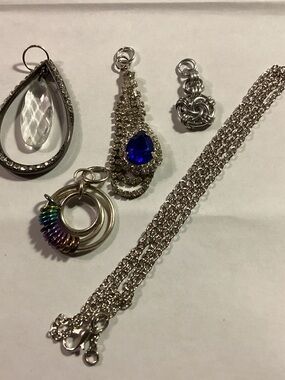 Interchangeable  silver toned pendant (s): 4 total with chain